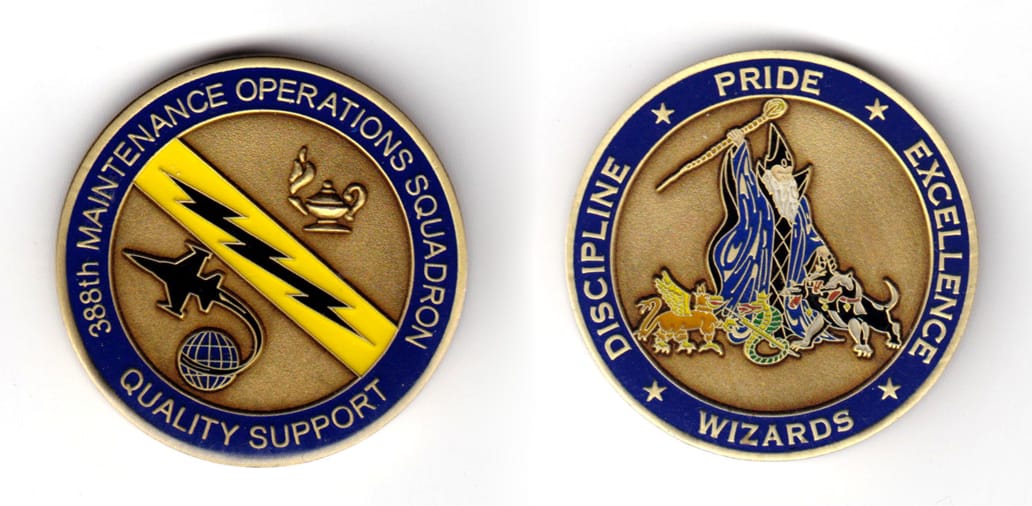 Round shaped coin, brass in color, 1 47/64 inches in diameter.