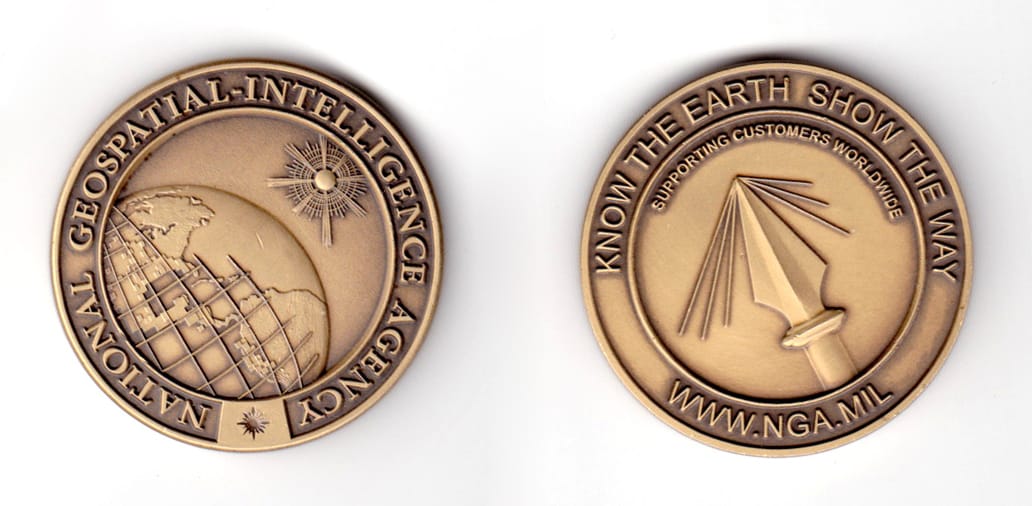 Round shaped coin, antique brass in color, 1 45/64 inches in diameter.