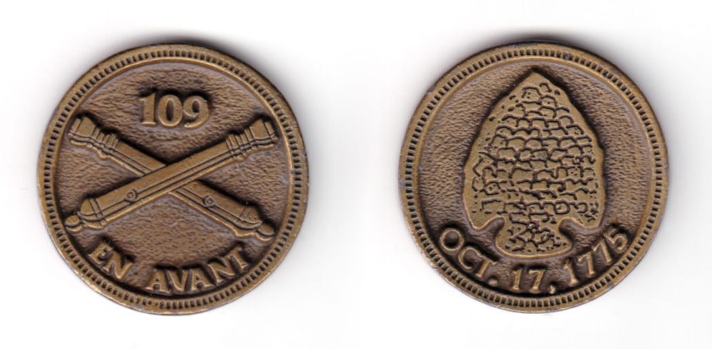 Round shaped coin, antique brass in color, 1 33/64 inches in diameter.