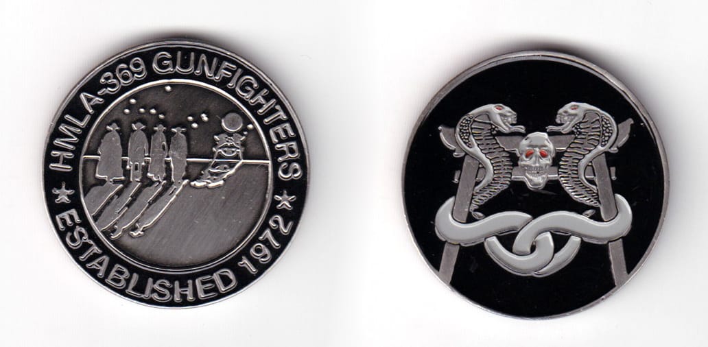 Round shaped coin, pewter in color, 1 1/2 inches in diameter.