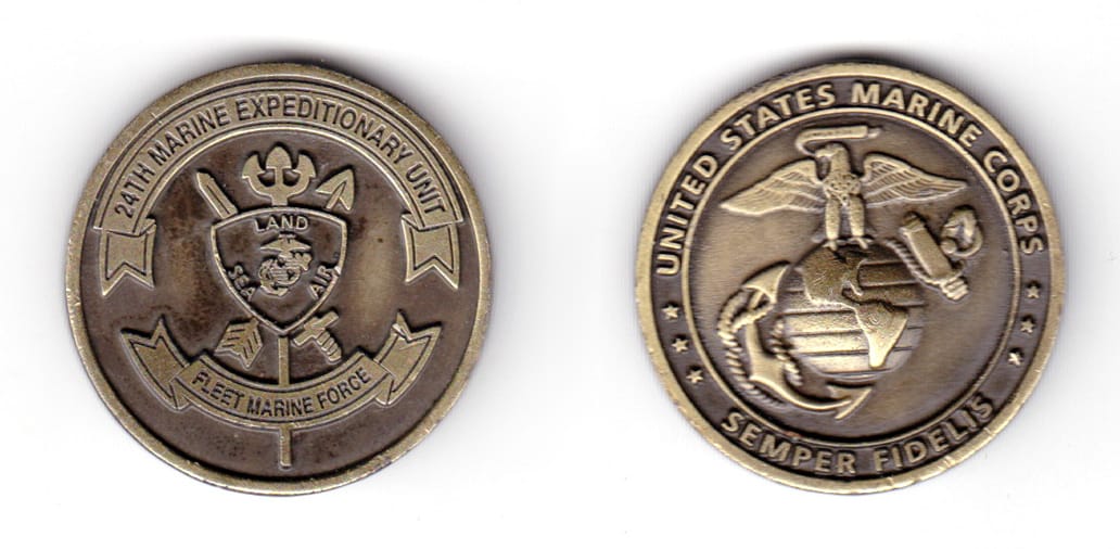 Round shaped coin, antique brass in color, 1 33/64 inches in diameter.