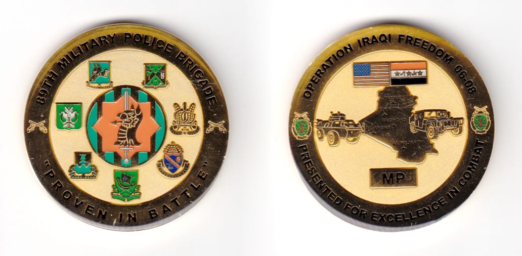 Round shaped coin, brass in color, 1 63/64 inches in diameter.