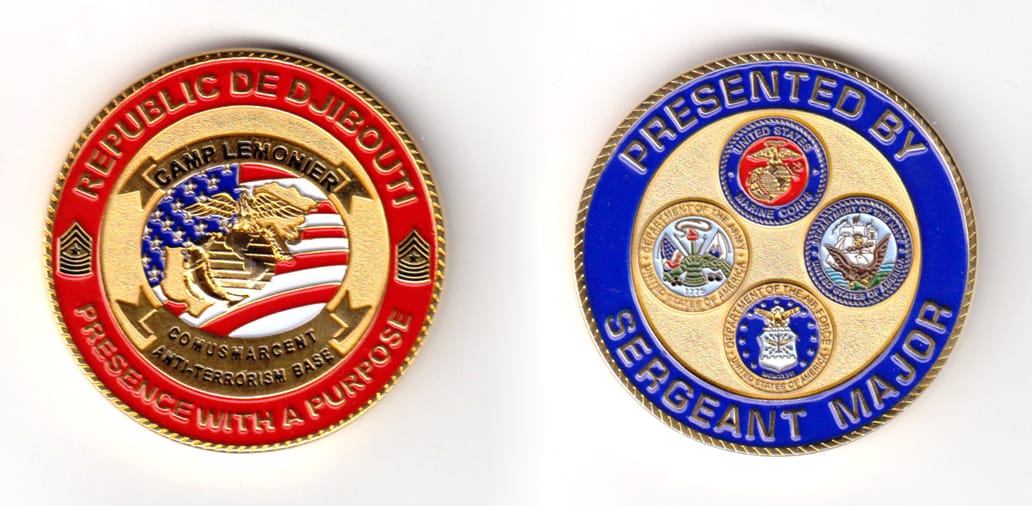 Round shaped coin, brass in color, 1 3/4 inches in diameter.