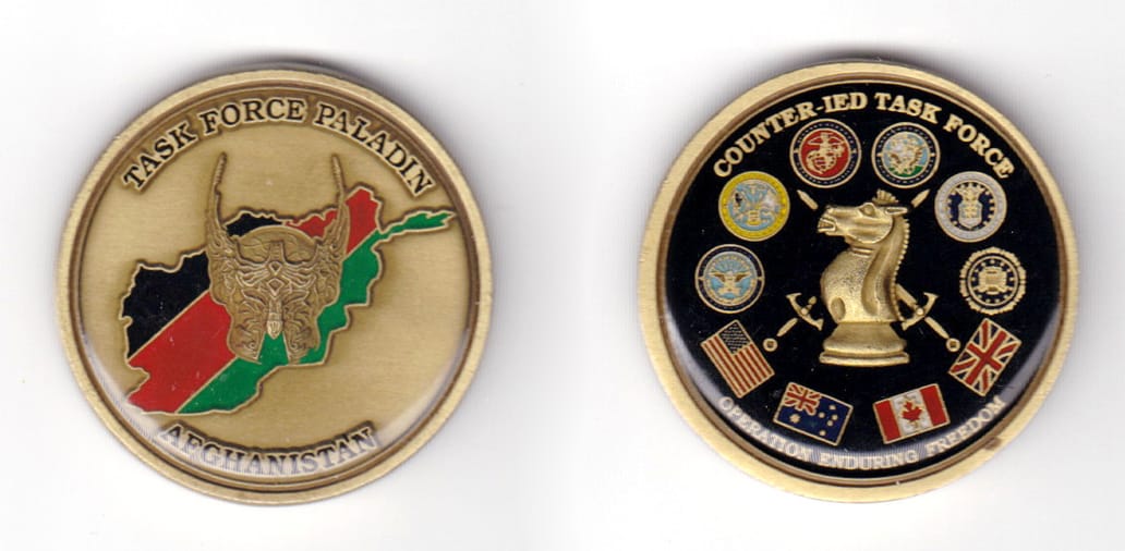 Round shaped coin, antique brass in color, 1 19/32 inches in diameter.