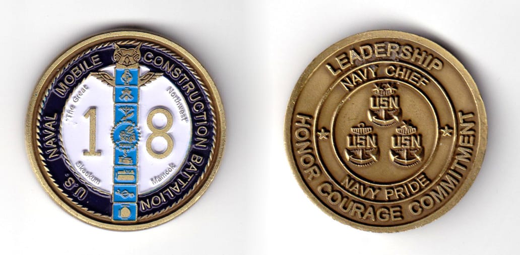 Round shaped coin, brass in color, 1 39/64 inches in diameter.