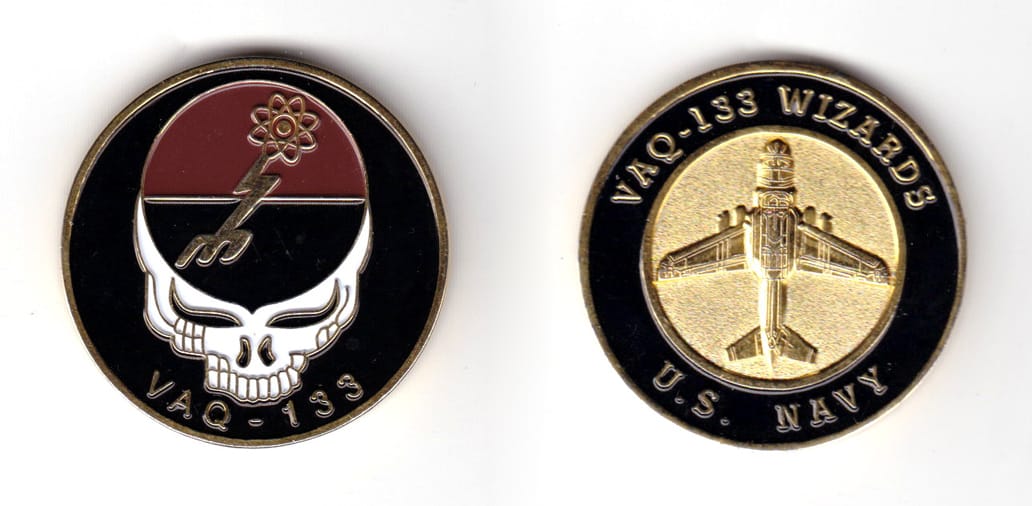 Round shaped coin, brass in color, 1 5/8 inches in diameter.