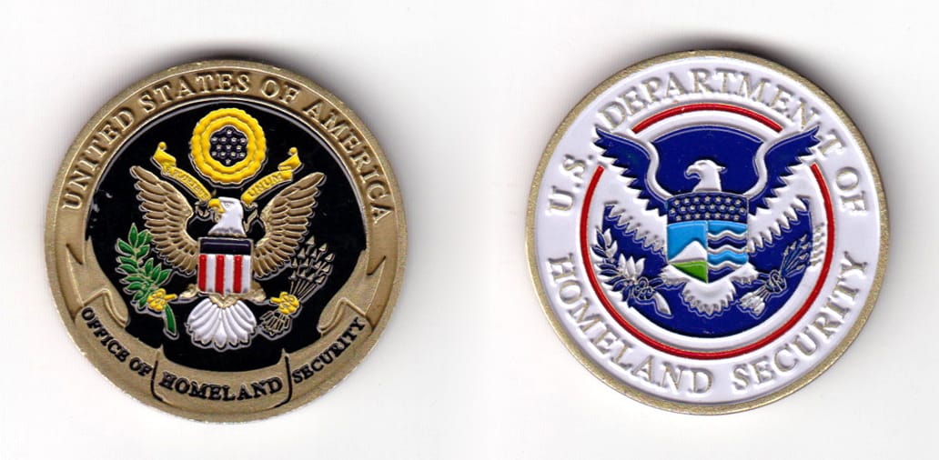 Round shaped coin, antique brass in color, 1 37/64 inches in diameter.