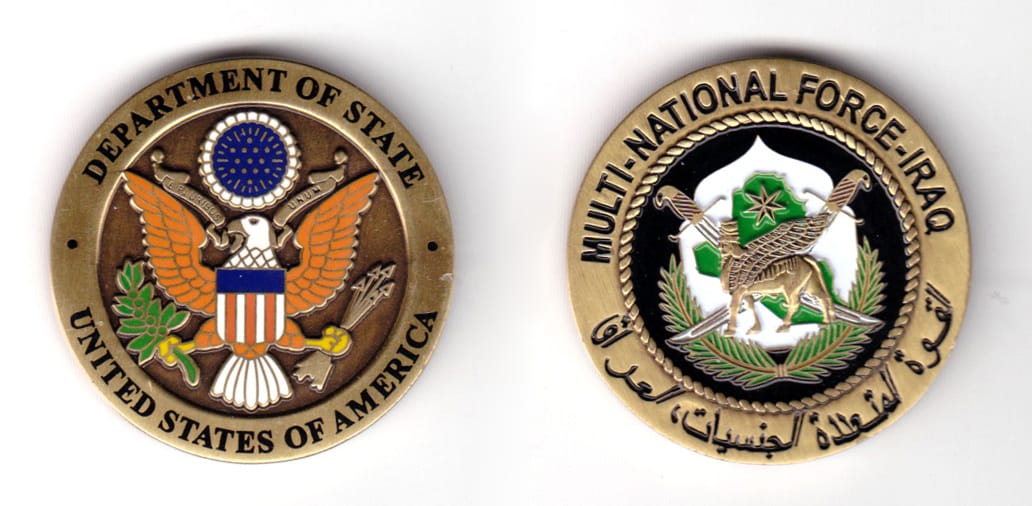 Round shaped coin, brass in color, 1 41/64 inches in diameter.