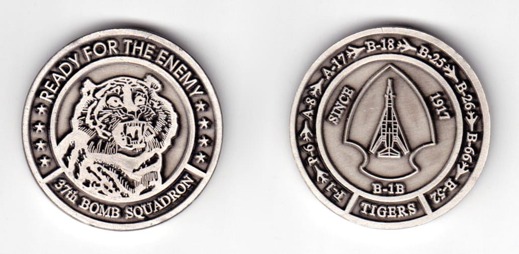 Round shaped coin pewter in color, 1 37/64 inches in diameter.