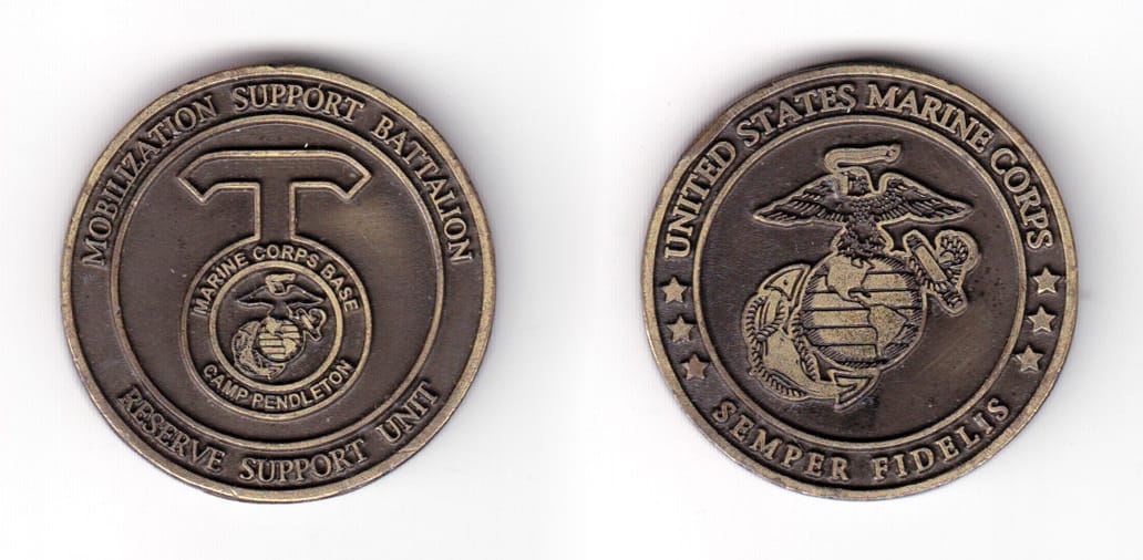 Round shaped coin, antique brass in color, 1 33/64 inches in diameter.