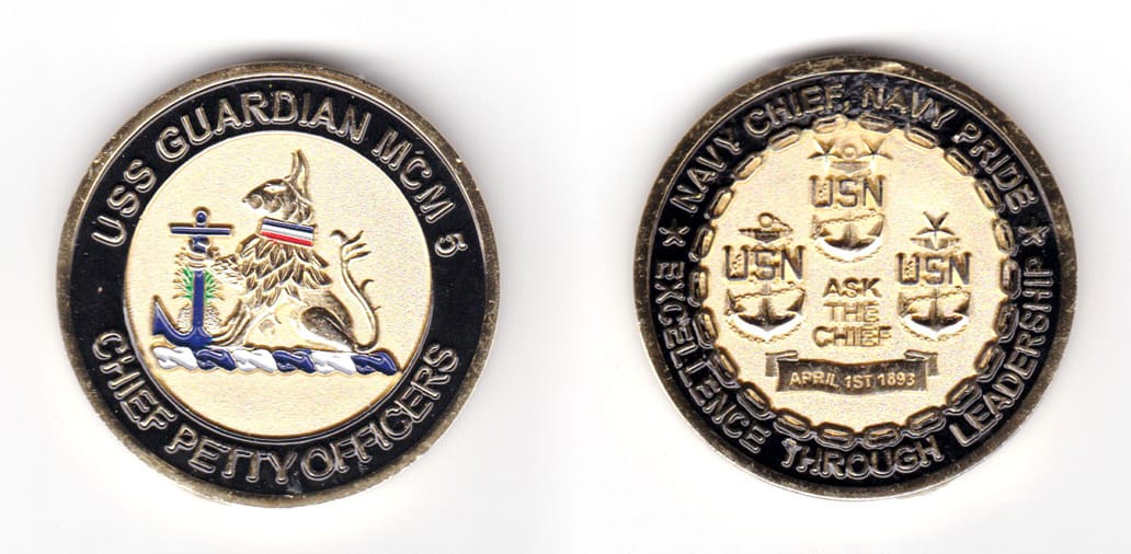 Round shaped coin, brass in color, 1 49/64 inches in diameter.