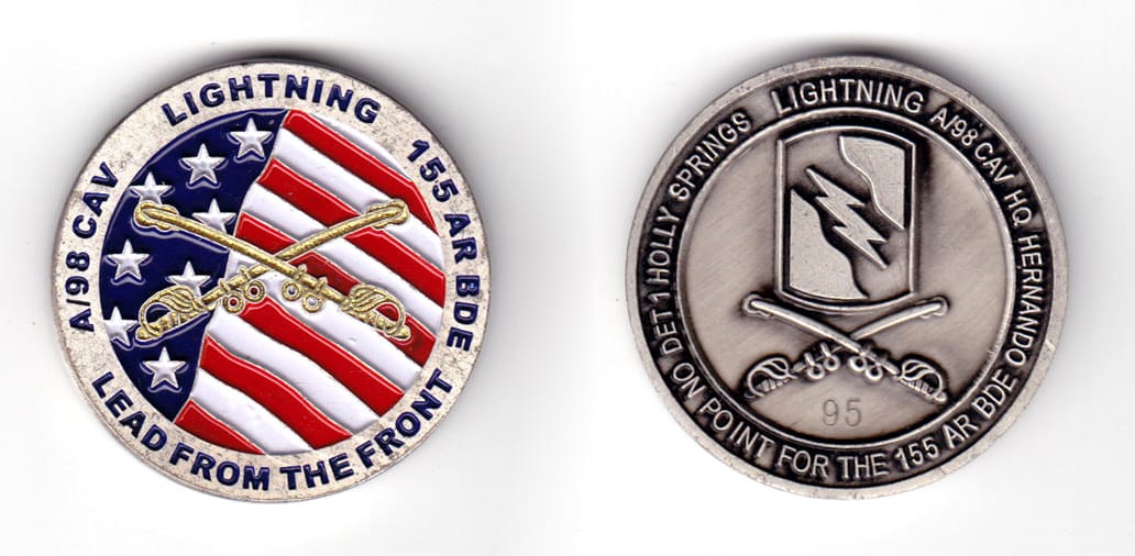 Round shaped coin, pewter in color, 1 49/64 inches in diameter.