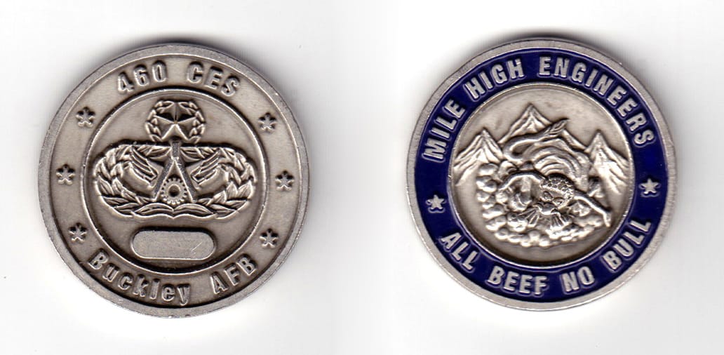 Round shaped coin, pewter in color, 1 37/64 inches in diameter.