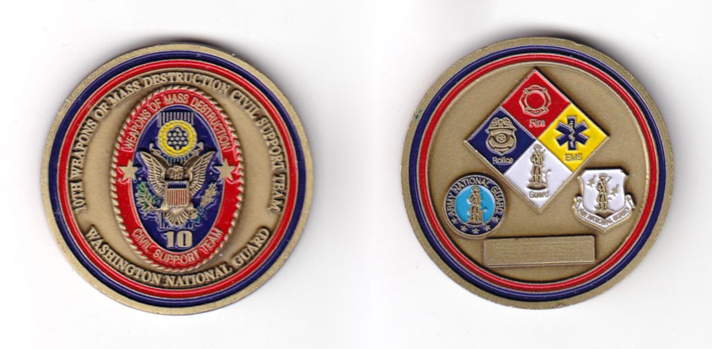 Round shaped coin, antique brass in color, 1 9/16 inches in diameter.