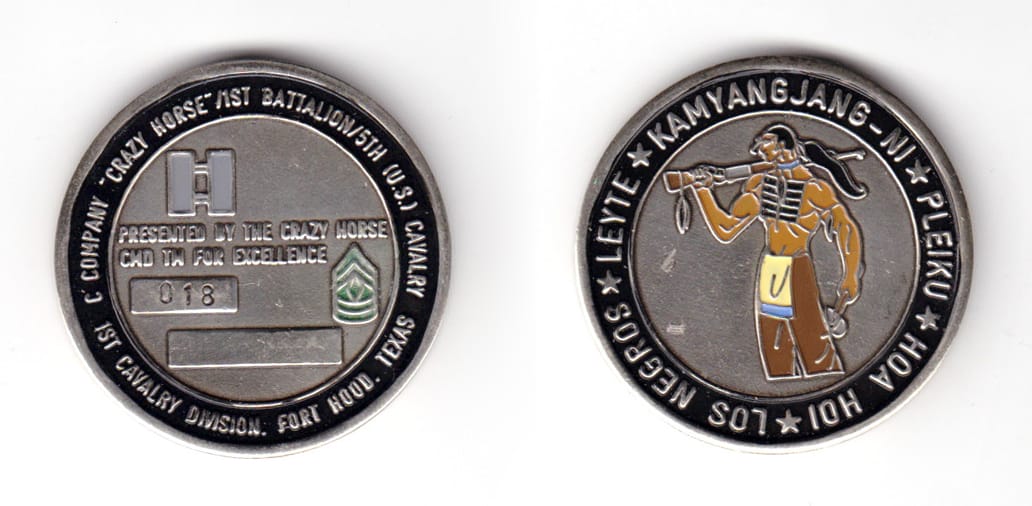 Round shaped coin, pewter in color, 1 43/64 inches in diameter.