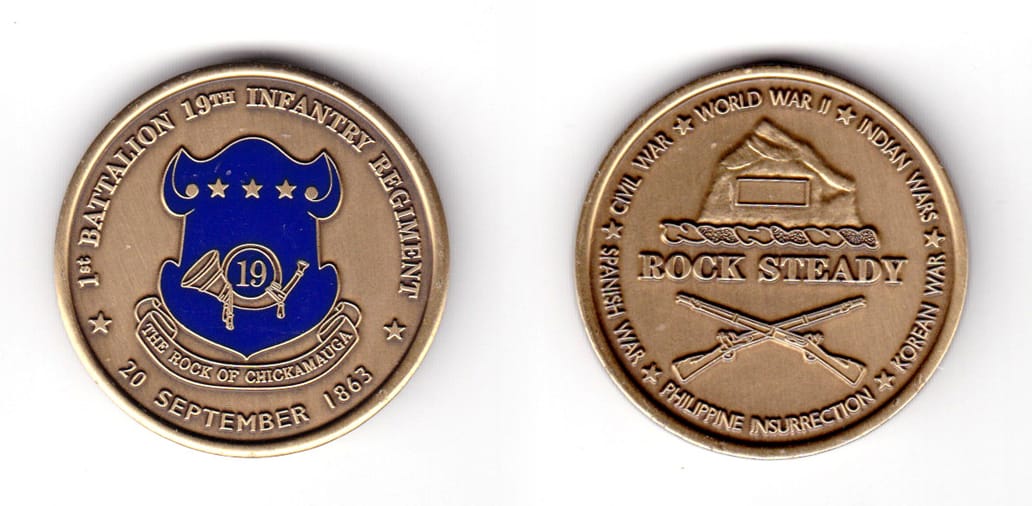 Round shaped coin, antique brass in color, 1 19/32 inches in diameter.