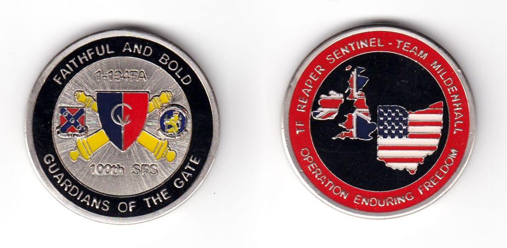 Round shaped coin, pewter in color, 1 43/64 inches in diameter.