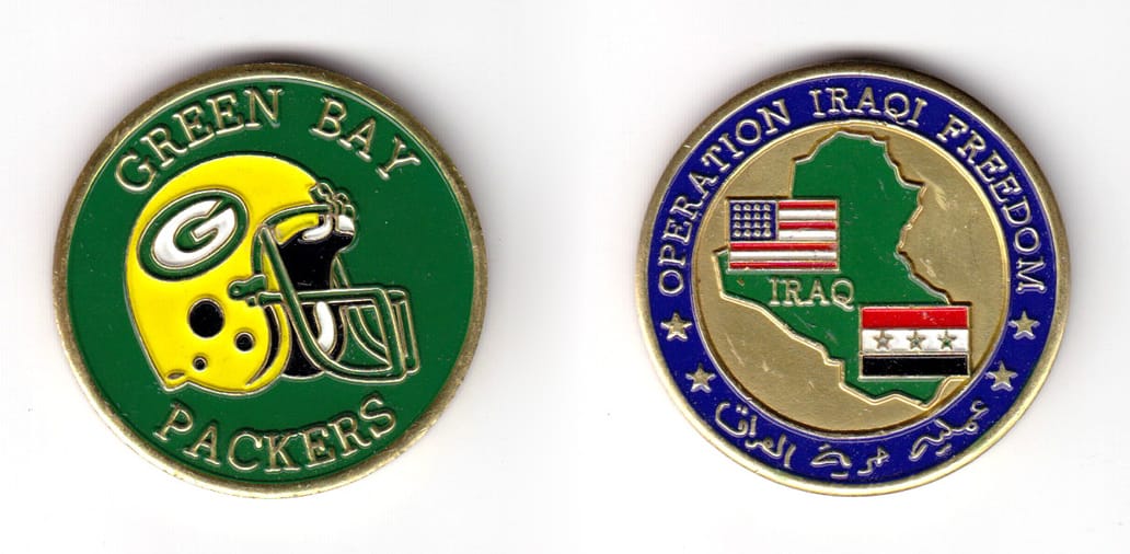 Round shaped coin, brass in color, 1 43/64 inches in diameter.