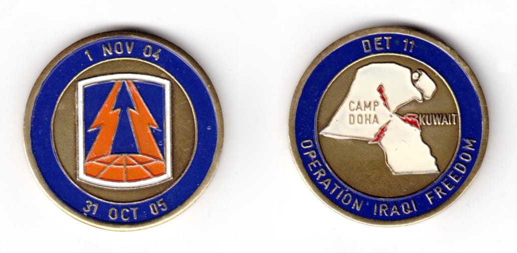 Round shaped coin, brass in color, 1 43/64 inches in diameter.