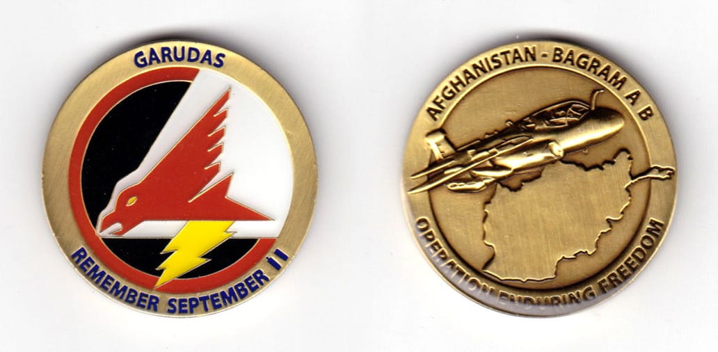 Round shaped coin brass in color, 1 35/64 inches in diameter.