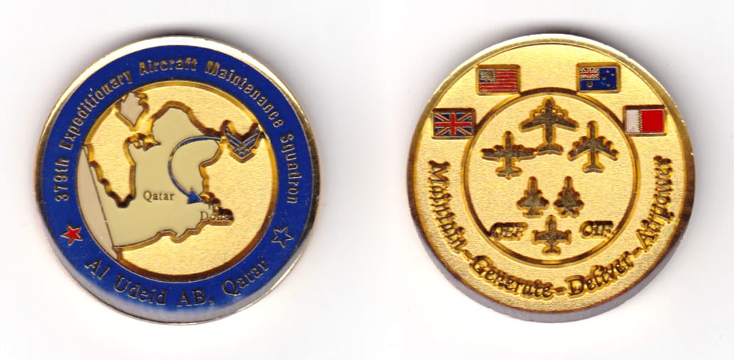 Round shaped coin, brass in color, 1 37/64 inches in diameter.