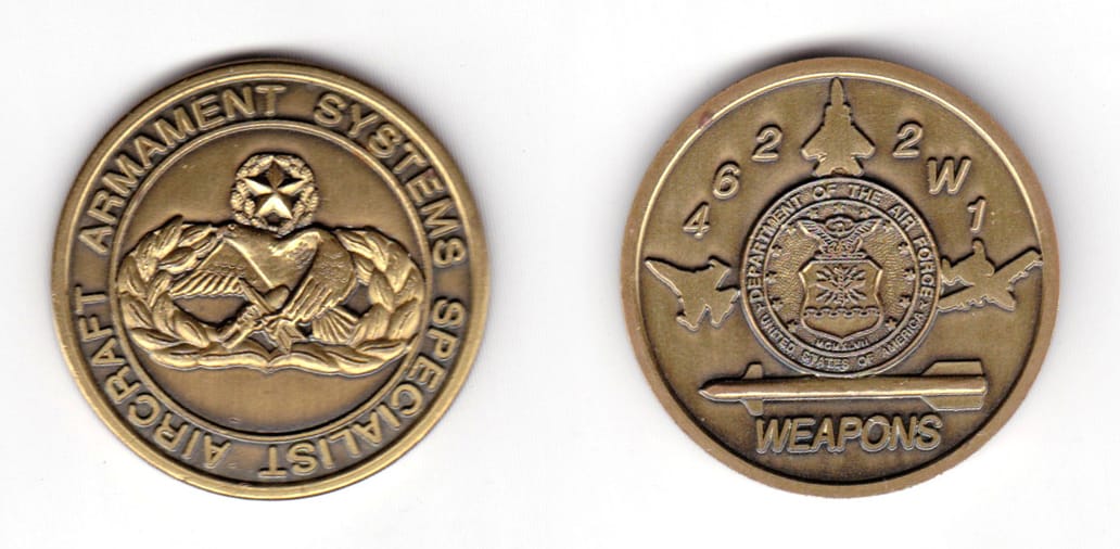 Round shaped coin, pewter in color, 135/64 inches in diameter.