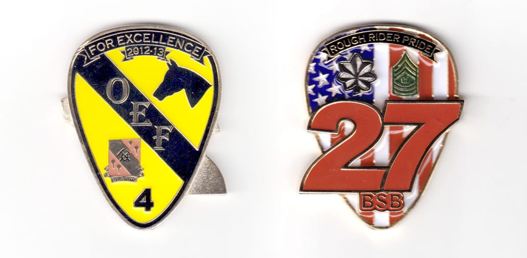 Shield shaped coin with the digits "27" behind and extending beyond the shield, brass in color, 2 29/64 inches high x 1 ...