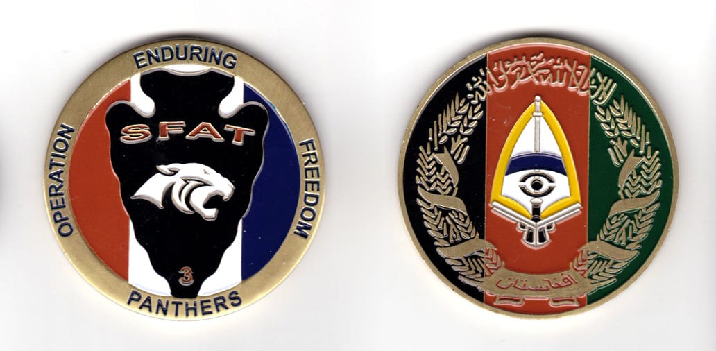 Round shaped coin, brass in color, 2 1/4 inches in diameter.