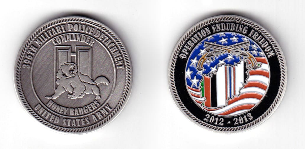 Round shaped coin, pewter in color, 1 1/2 inches in diameter.