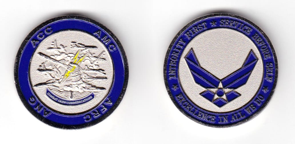 Round shaped coin, pewter in color, 1 1/2 inches in diameter.