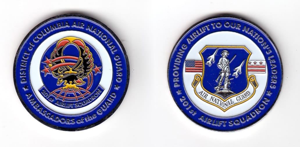 Round shaped coin, pewter in color, 1 49/64 inches in diameter.