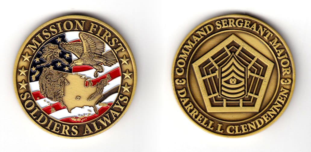 Round shaped coin, brass in color, 1 49/64 inches in diameter.