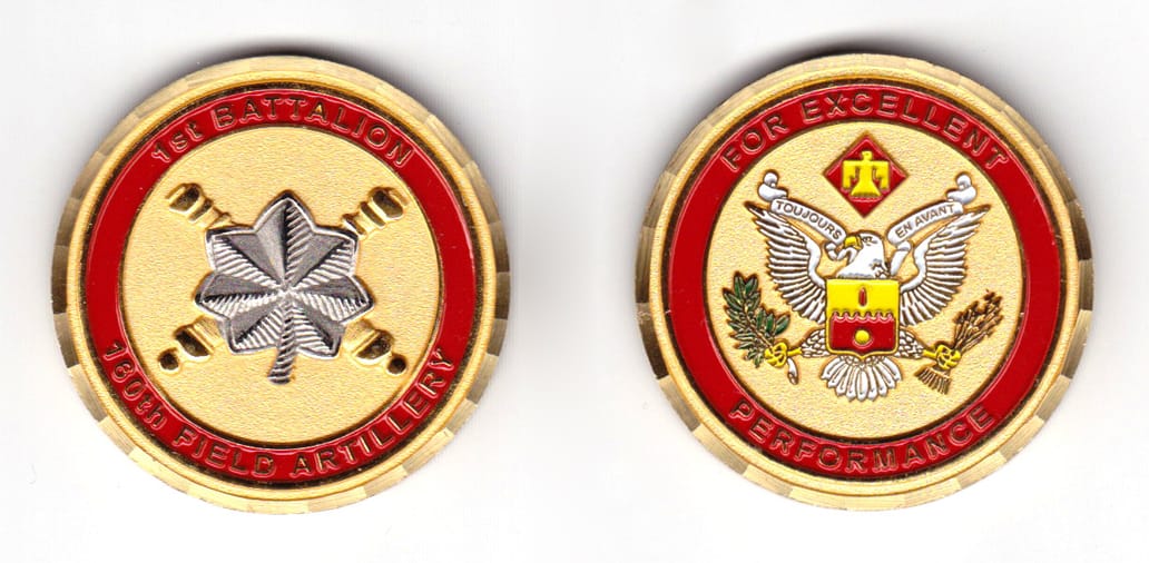 Round shaped coin, brass in color, 1 41/64 inches in diameter.