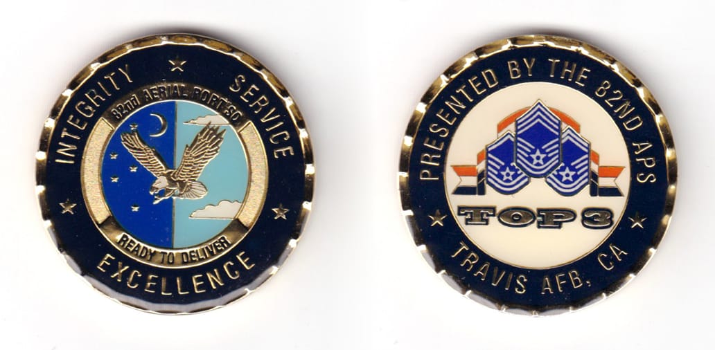 Round shaped coin, brass in color, 1 47/64 inches in diameter.