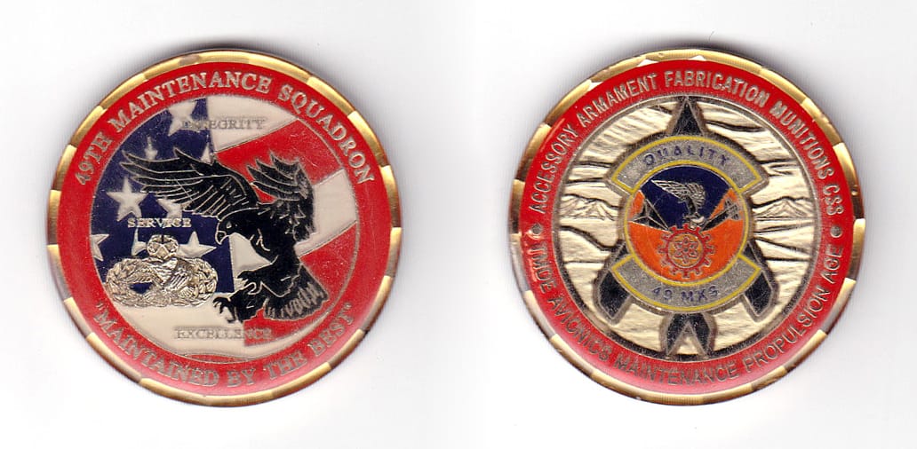 Round shaped coin, pewter in color, 1 25/32 inches in diameter.