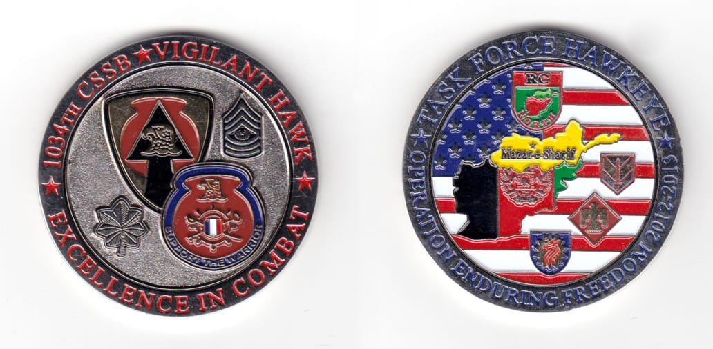 Round shaped coin, silver in color, 2 1/32 inches in diameter.