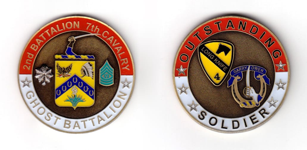 Round shaped coin, brass in color, 1 63/64 inches in diameter.