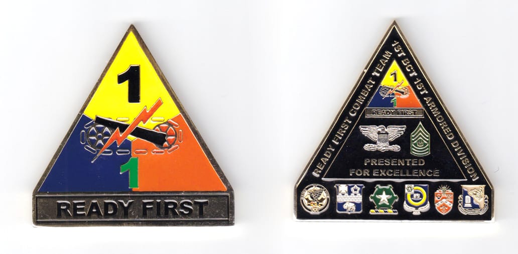 Triangular shaped coin with rectangular banner under, brass in color, 2 33/64 inches high x 2 1/2 inches wide.