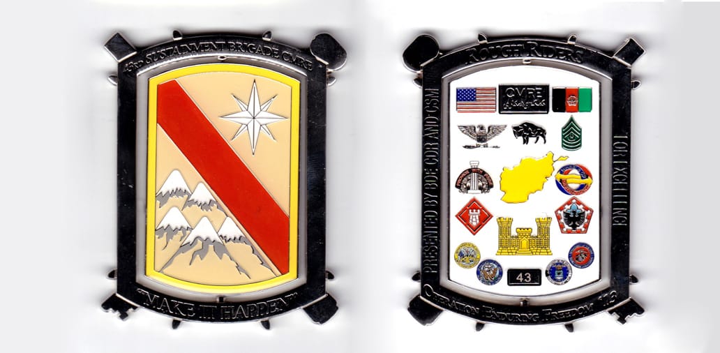 Rectangular shaped spinner with short sides rounded, crossed keys behind and 2 small nubs protruding from each side, pew...