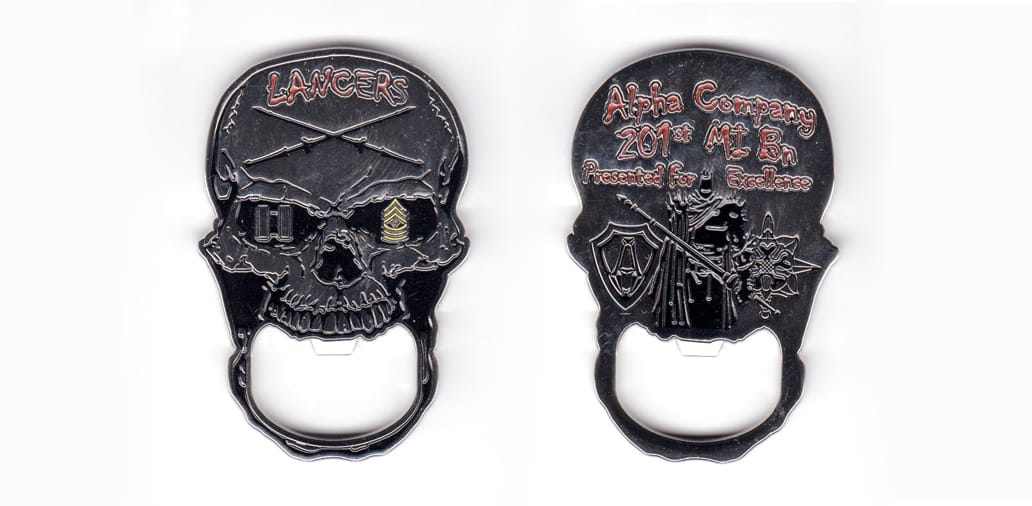 Skull shaped bottle opener, silver in color, 2 17/32 inches high x          1 43/64 inches wide.