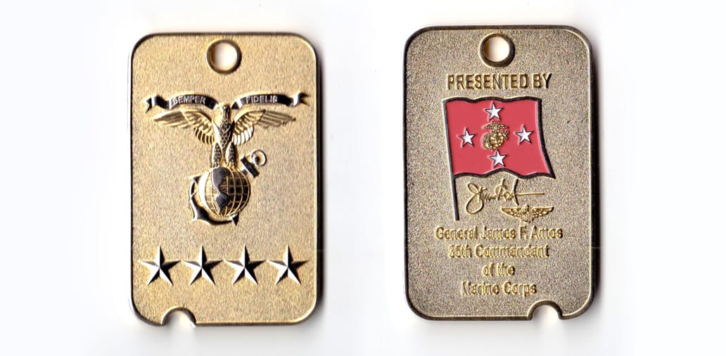 Rectangular shaped coin with amall notch cut from one short side, brass in color, 1 5/8 inches high x 2 3/64 inches wide...