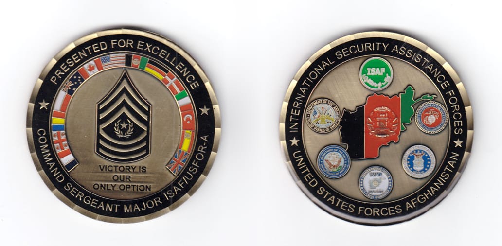 Round shaped coin, antique brass in color, 2 29/32 inches in diameter.