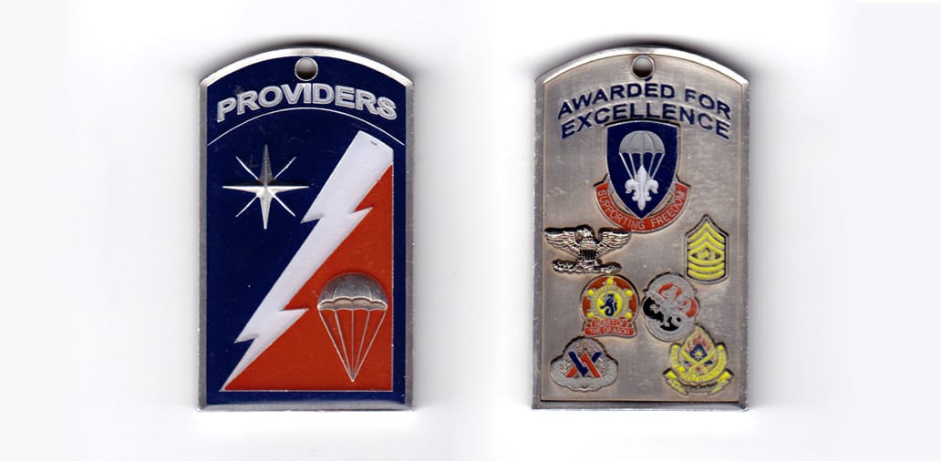 Rectantular shaped coin with top side arched outwardly, pewter in color, 2 15/64 inches high x 1 11/32 inches wide.