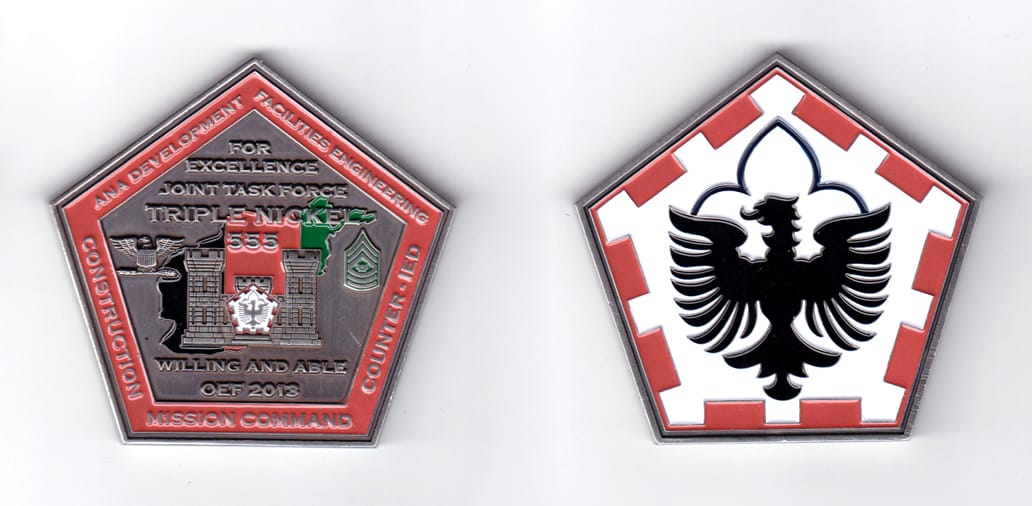 Pentagon shaped coin, pewter in color, 2 1/2 inches high x 2 5/8 inches wide.