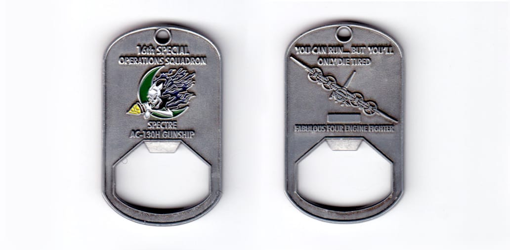 Dog tag shaped bottle opener, antique pewter in color, 2 3/64 inches high x 1 1/4 inches wide.