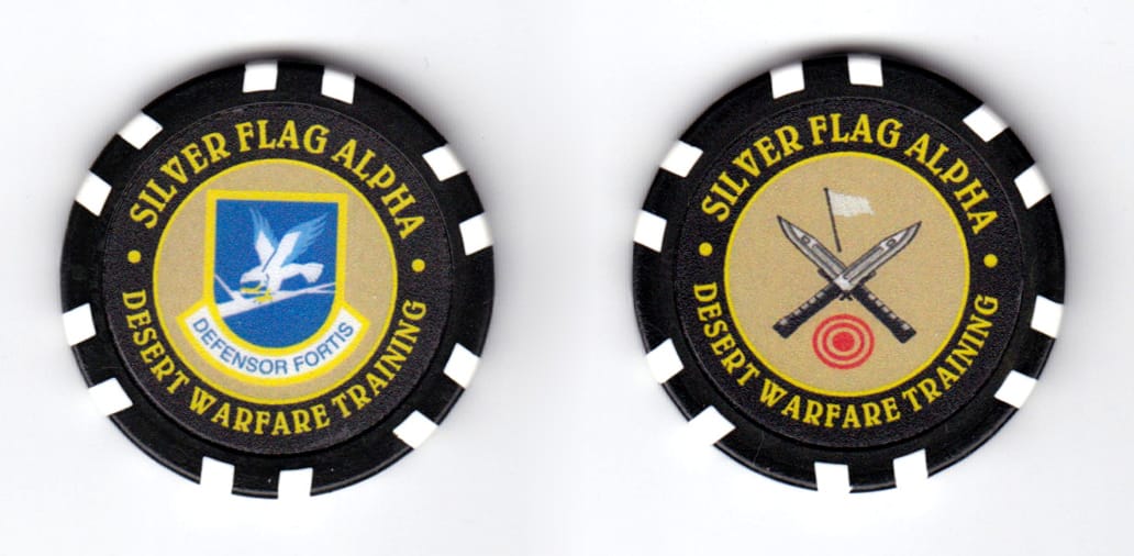 Round shaped poker chip, black & white in color, 1 37/64 inches in diameter.