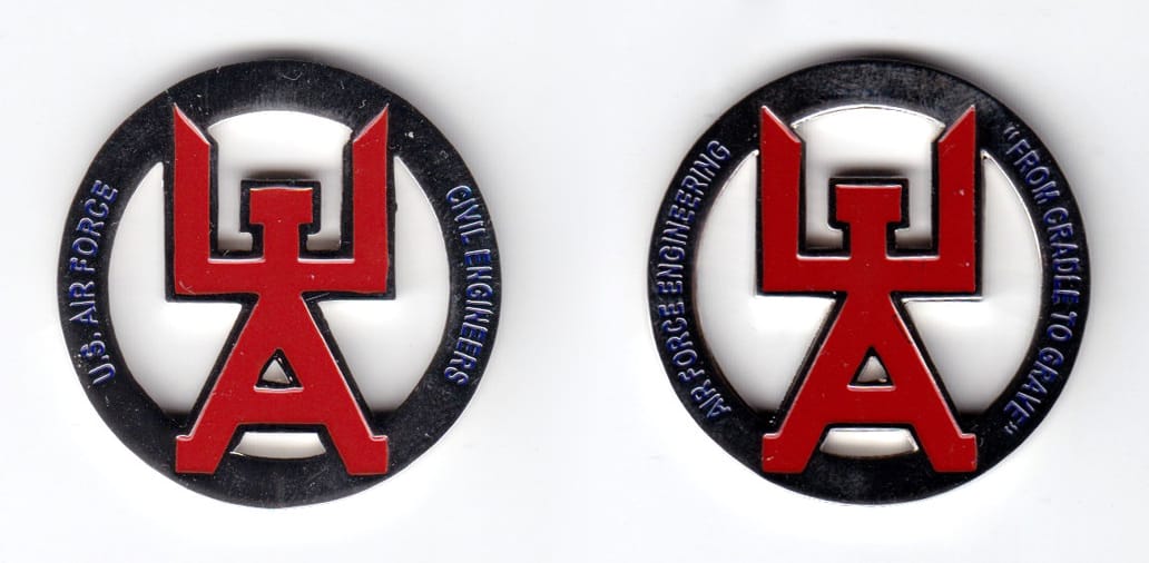 Round shaped coin, silver in color, 1 31/64 inches in diameter.