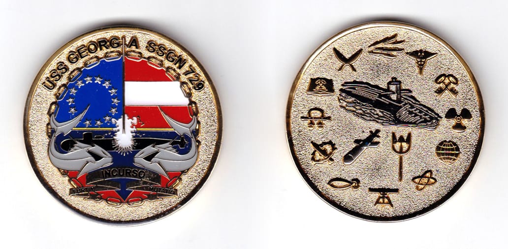 Round shaped coin, brass in color, 2 inches in diameter.