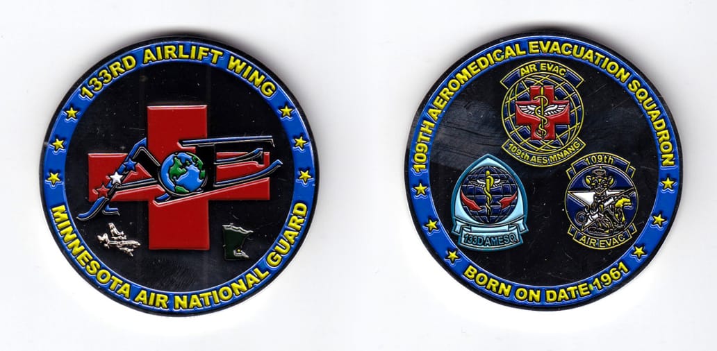 Round shaped coin, silver in color, 2 inches in diameter.