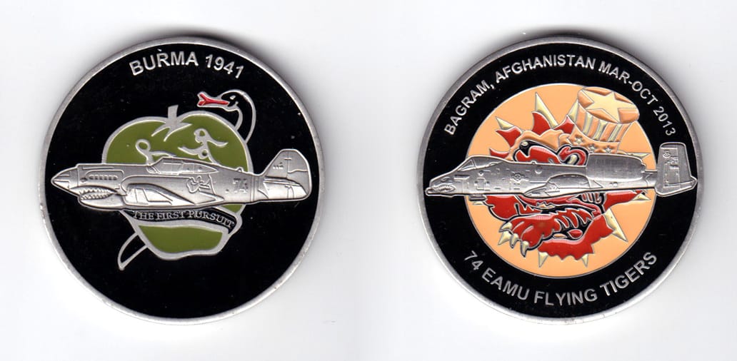 Round shaped coin, pewter in color, 2 inches in diameter.